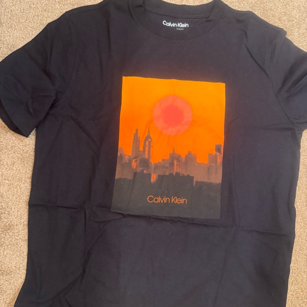 Calvin Klein Black Tee with Vibrant Orange Design